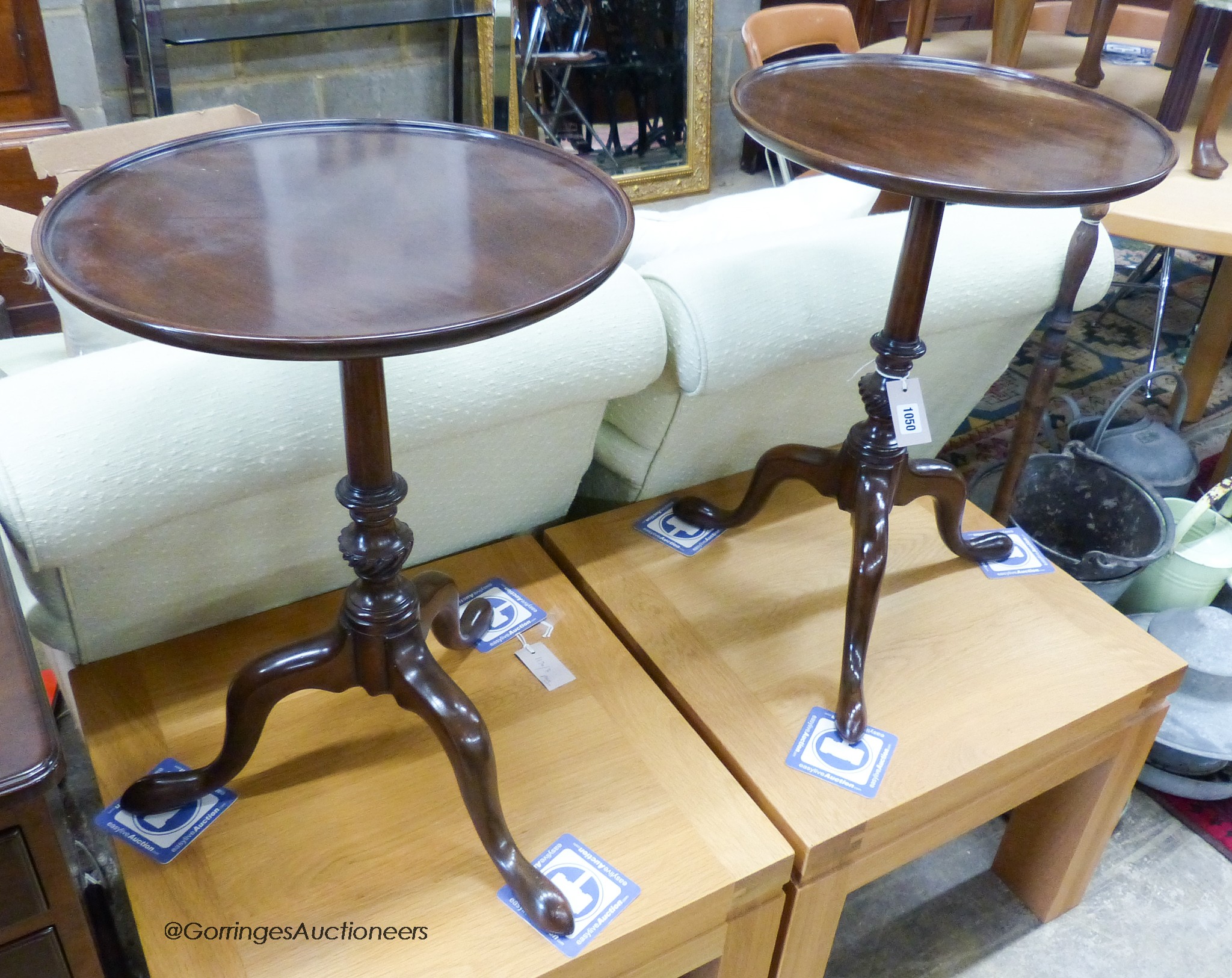 A pair of modern Kittinger furniture Georgian style mahogany circular top tripod tables. D-40, H-58cm.